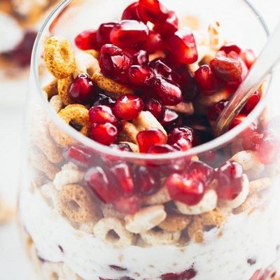 5 Minute Honey Yogurt Quinoa Parfait in a glass with a spoon.