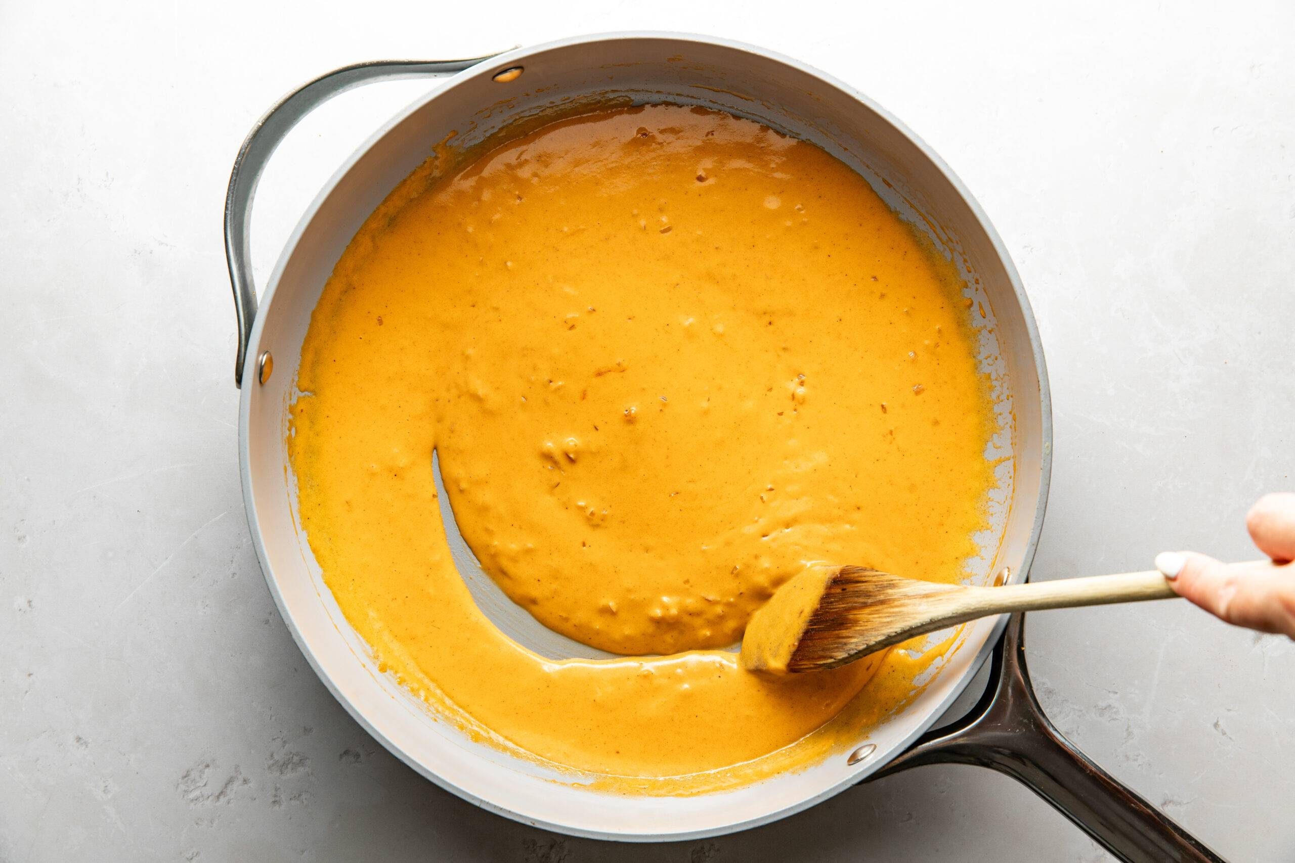 Creamy cajun sauce in a skillet.