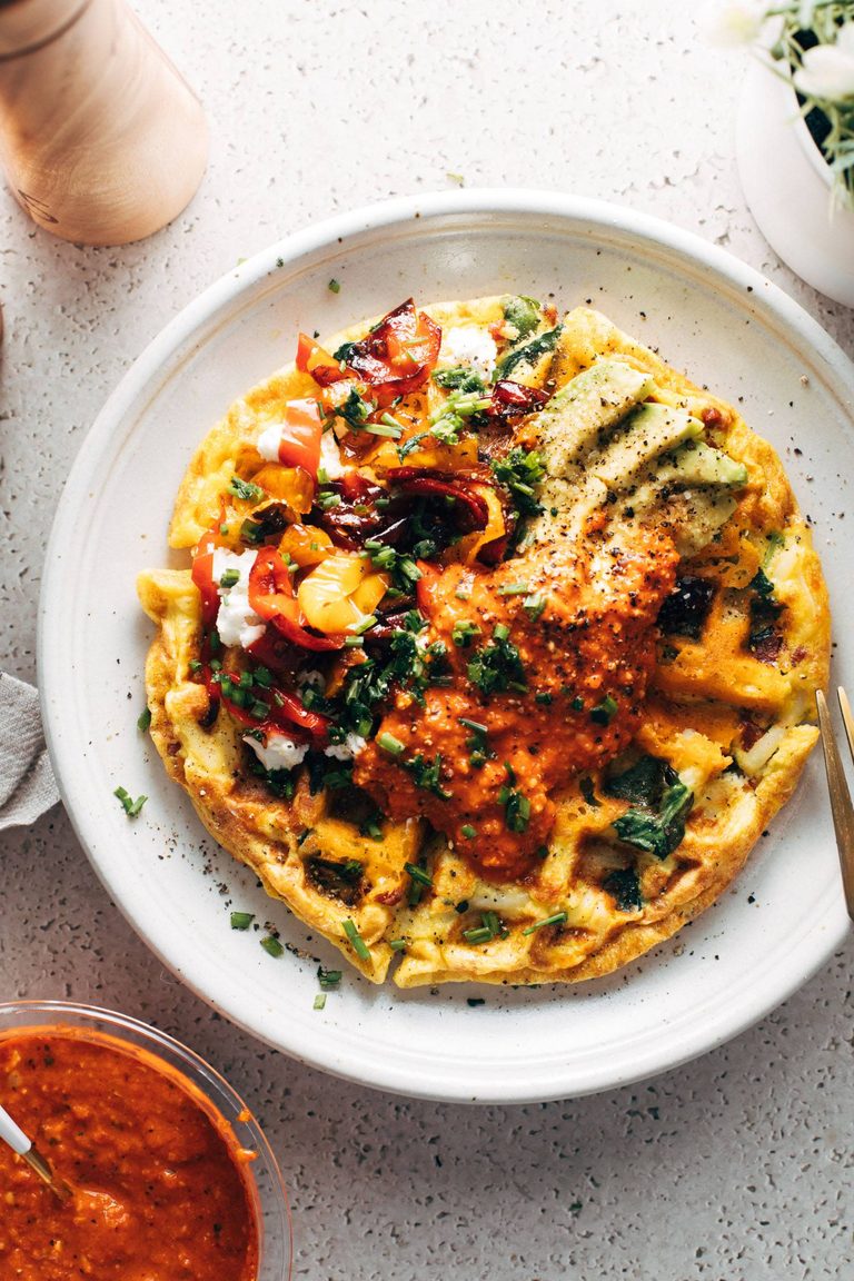 Egg waffles topped with romesco.