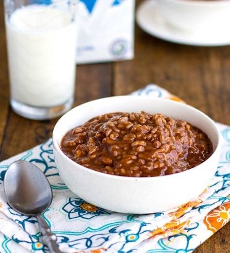 Filipino champorado in a bowl on a colorful napkin.